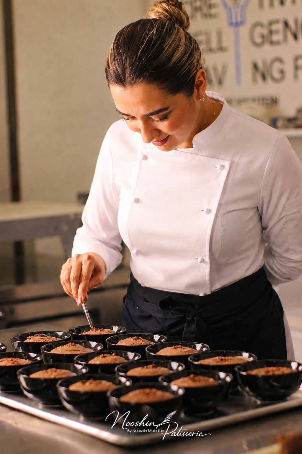 Chef Nooshin finishing dark chocolate mousse